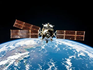 A satellite in orbit above Earth with solar panels extended and blue planet curvature visible